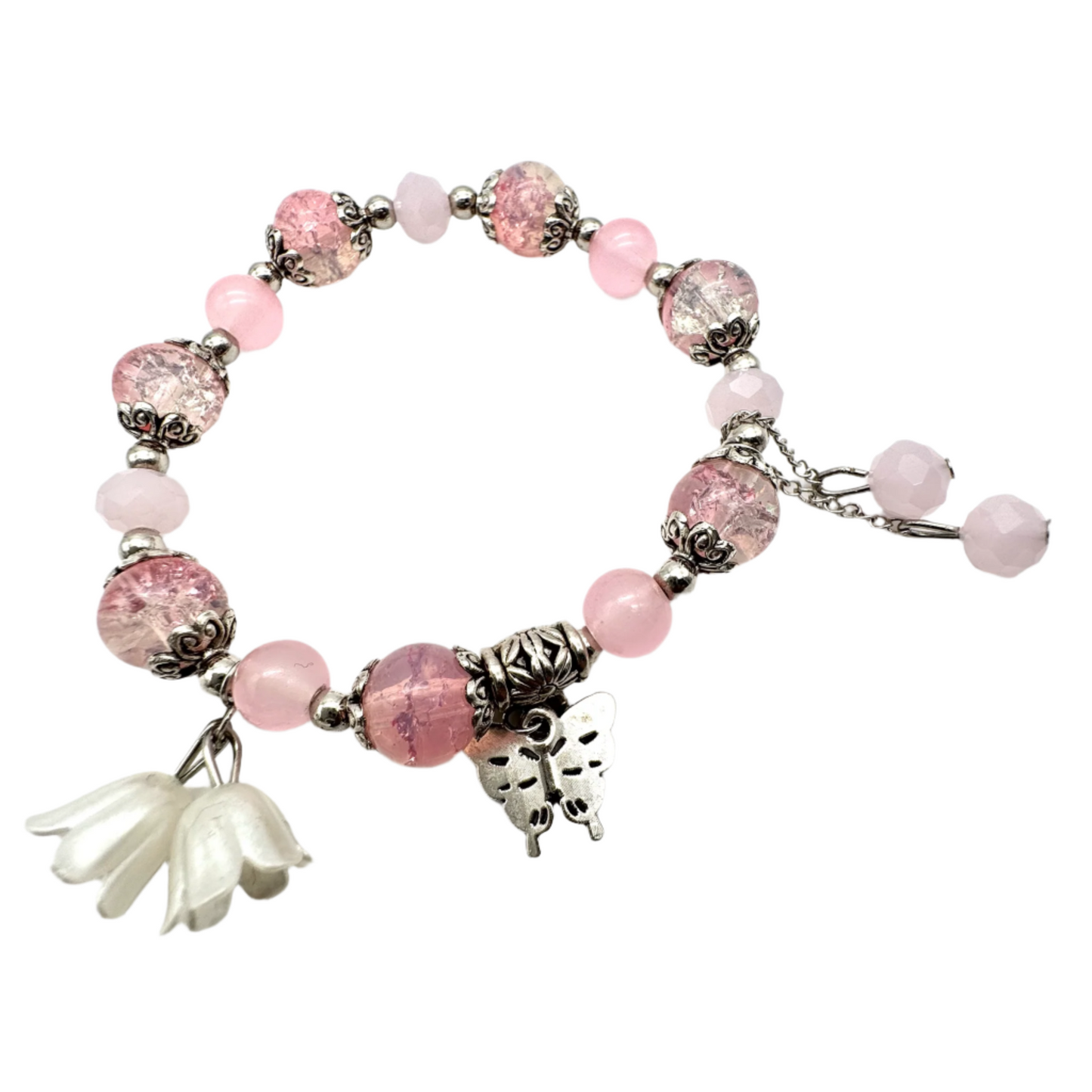 Roze kralen stretch armband met zilveren spacers en vlinder bedel